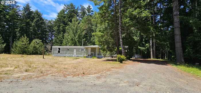 photo 1: 71290 CLIFTON RD, North Bend OR 97459