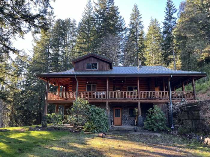 photo 1: 9373 N FORK SIUSLAW RD, Florence OR 97439