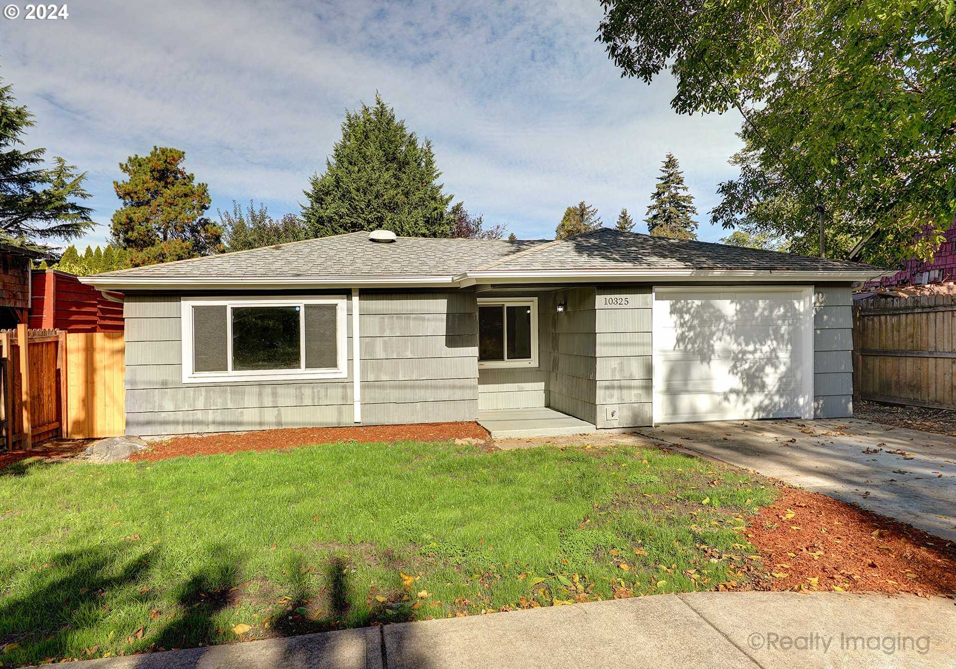 photo 1: 10325 SE REEDWAY ST, Portland OR 97266