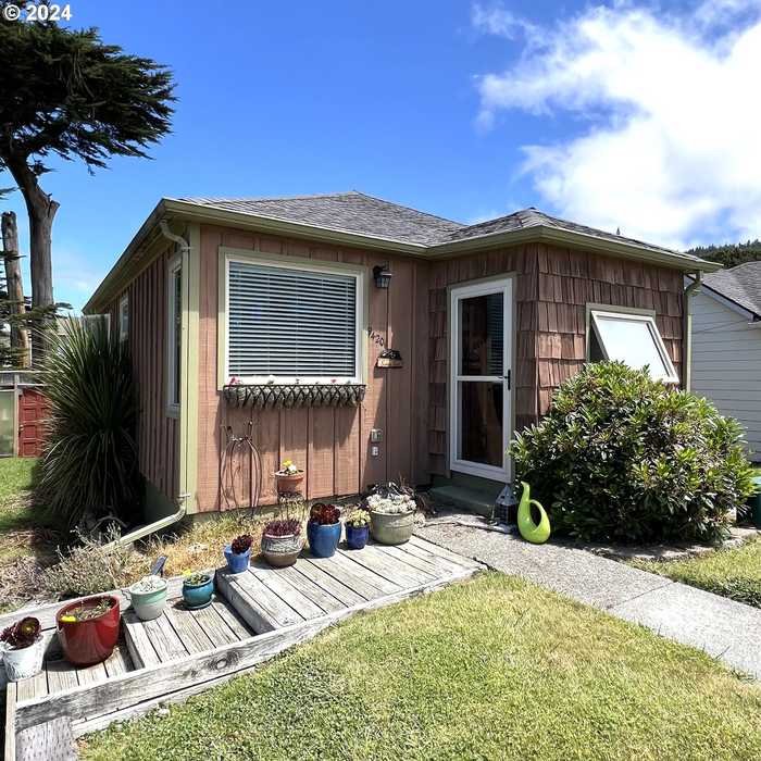 photo 1: 94201 4TH ST, Gold Beach OR 97444