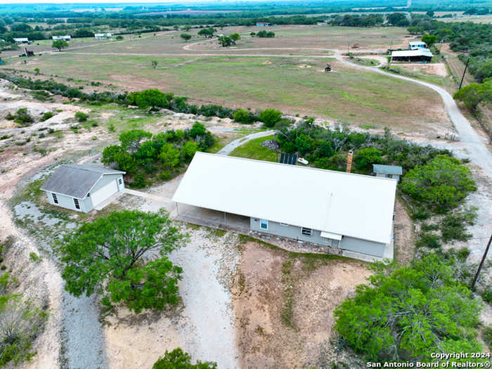 photo 1: 405 COUNTY ROAD 6642, Devine TX 78016