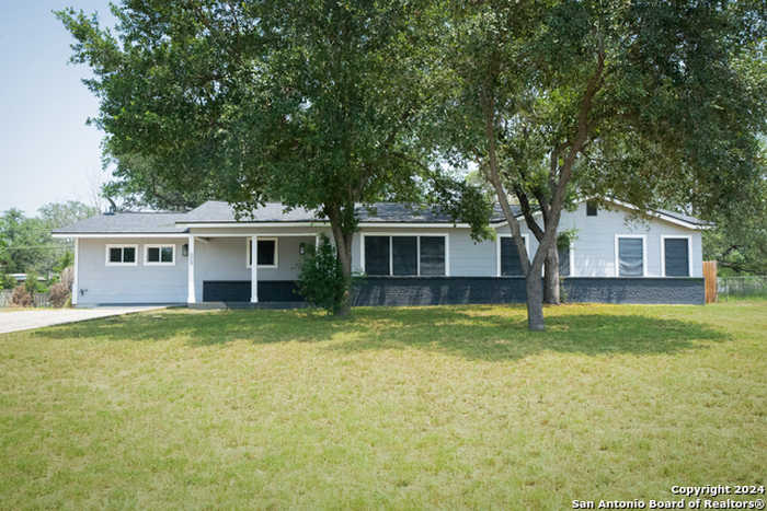 photo 1: 609 Hickory Highway, Devine TX 78016