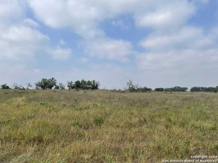 photo 1: TRACT #16 12.17 County Road 777, Devine TX 78016