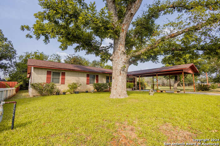 photo 1: 712 DOVE AVE, Devine TX 78016