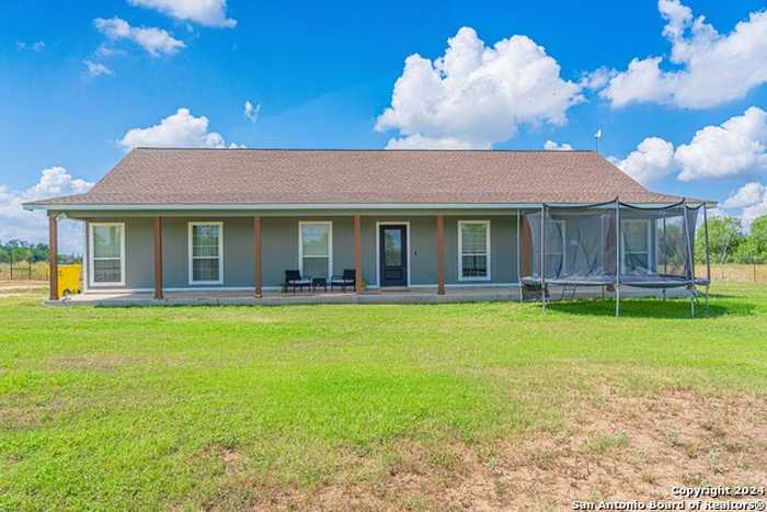 photo 1: 133 COUNTY ROAD 6611, Devine TX 78016