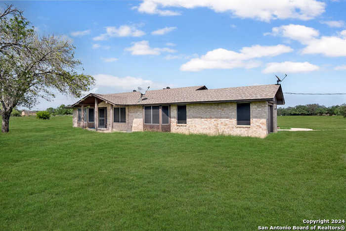 photo 1: 332 COUNTY ROAD 763, Devine TX 78016