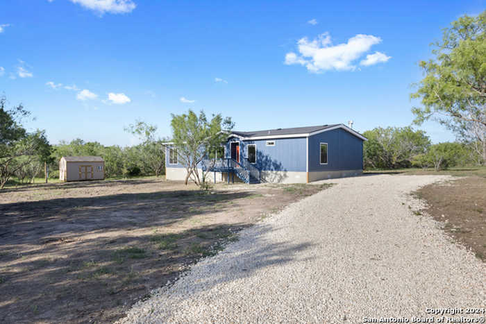 photo 1: 415 S County Road 321, Jourdanton TX 78026