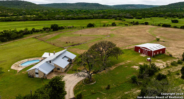 photo 1: 1407 Hay Hollar Rd, Bandera TX 78003