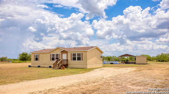 photo 1: 682 COUNTY ROAD 6725, Devine TX 78016