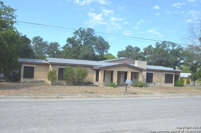 photo 1: 411 W Moore Ave., Devine TX 78016