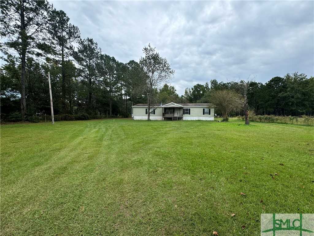 photo 1: 722 Sunshine Road, Ellabell GA 31308