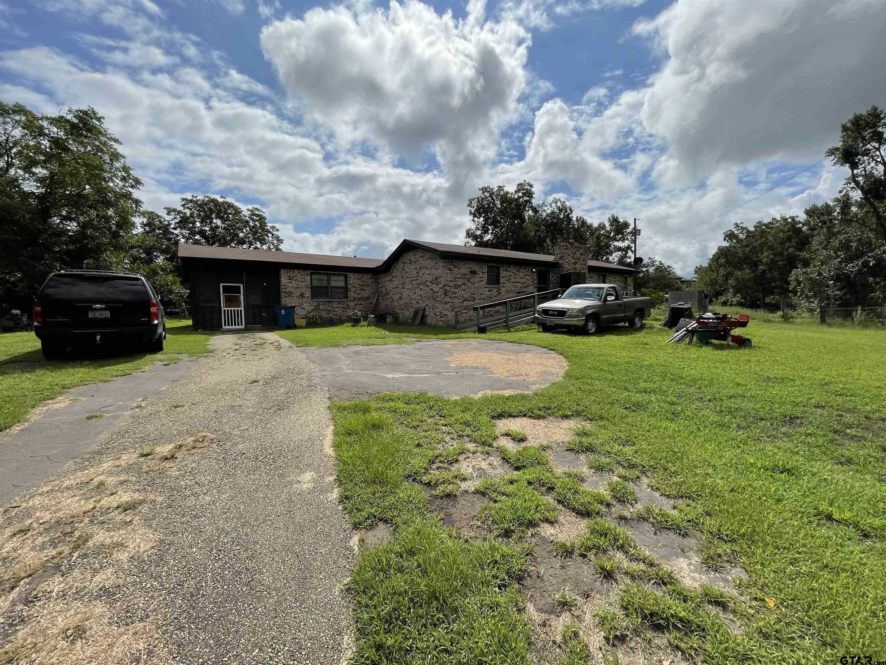 photo 1: 1011 Gilmer Rd, Winnsboro TX 75494